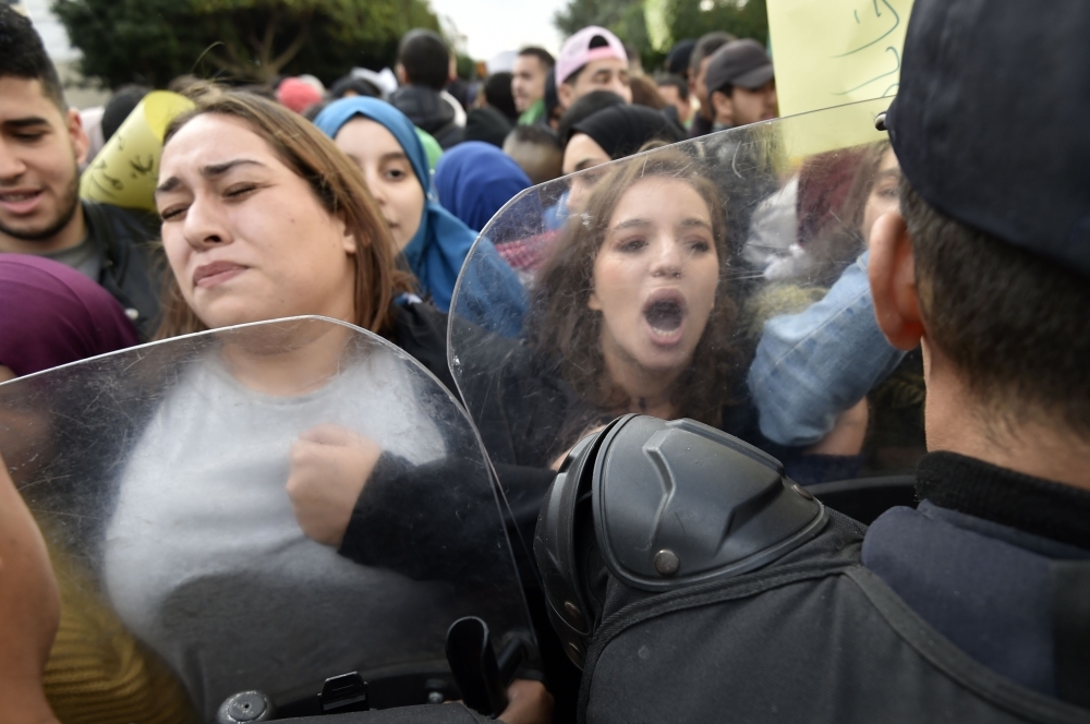 Algerian students shout slogans during an anti-government demonstration in the capital Algiers on Monday ahead of the presidential vote scheduled for Dec. 12. — AFP