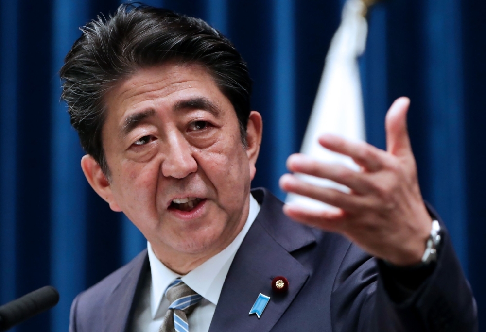 Japan's Prime Minister Shinzo Abe speaks during a press conference in Tokyo on Monday. — AFP