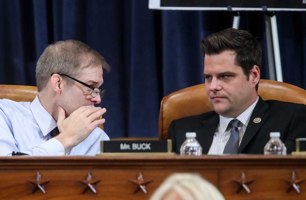 Republican House members Rep. Jim Jordan (R-OH) confers with Rep. Matt Gaetz (R-FL) during a break as the House Judiciary Committee holds a hearing to receive counsel presentations of evidence on the impeachment inquiry into US President Donald Trump on Capitol Hill in Washington on Monday. — AFP