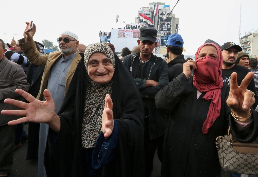 An Iraqi demonstrator wears a Guy Fawkes mask at Tahrir square in the capital Baghdad amid ongoing anti-government protests on Tuesday. — AFP