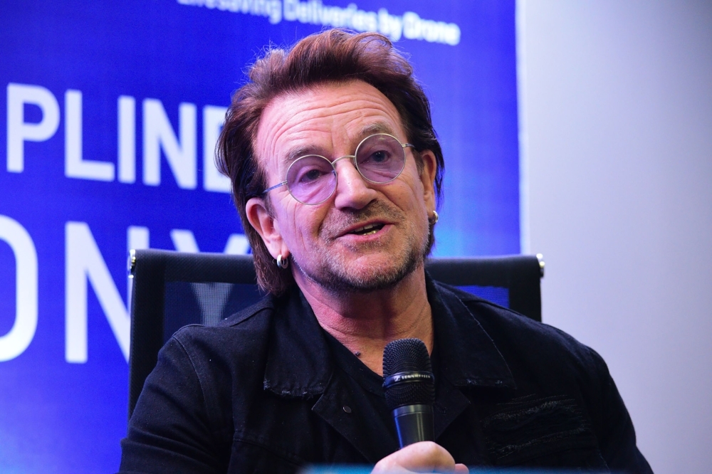 U2 frontman singer Bono speaks to the media during a signing ceremony in Manila on Tuesday. — AFP