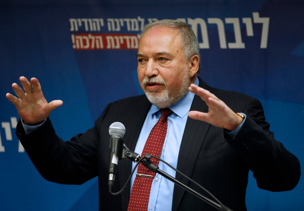 Yisrael Beitenu's party head Avigdor Lieberman delivers a statement to the press in Jerusalem on Wednesday. — AFP