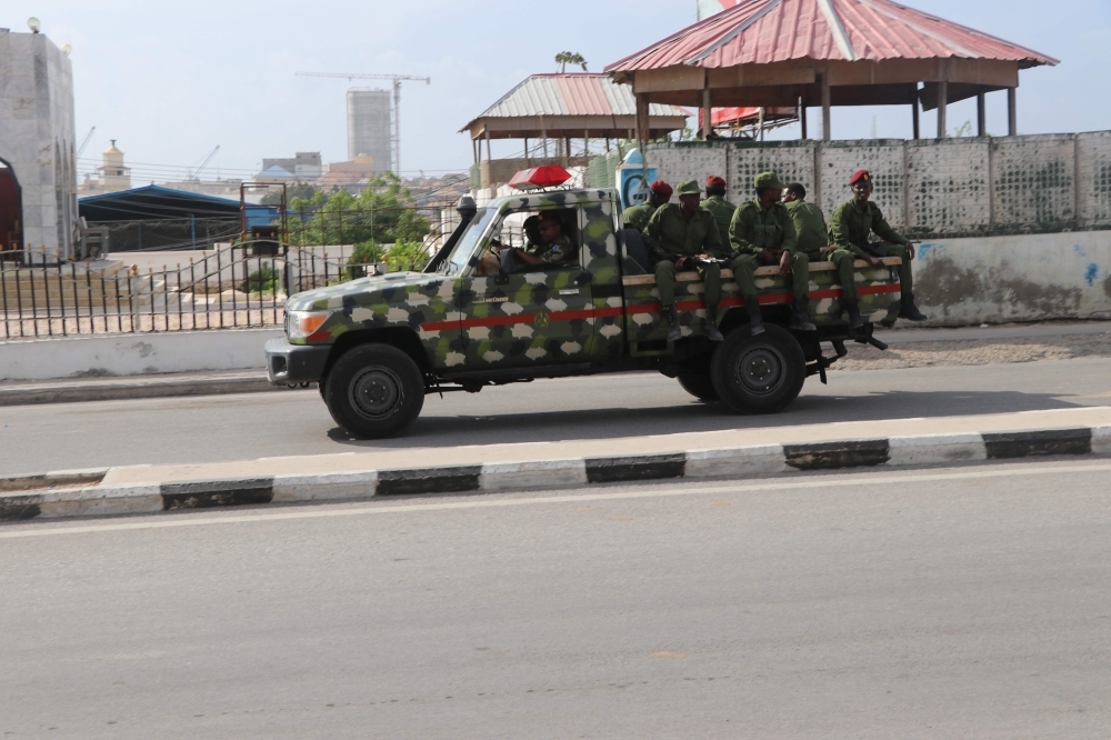 Somali government soldiers on a military vehicle are seen outside the SYL hotel in Mogadishu on Wednesday. — AFP