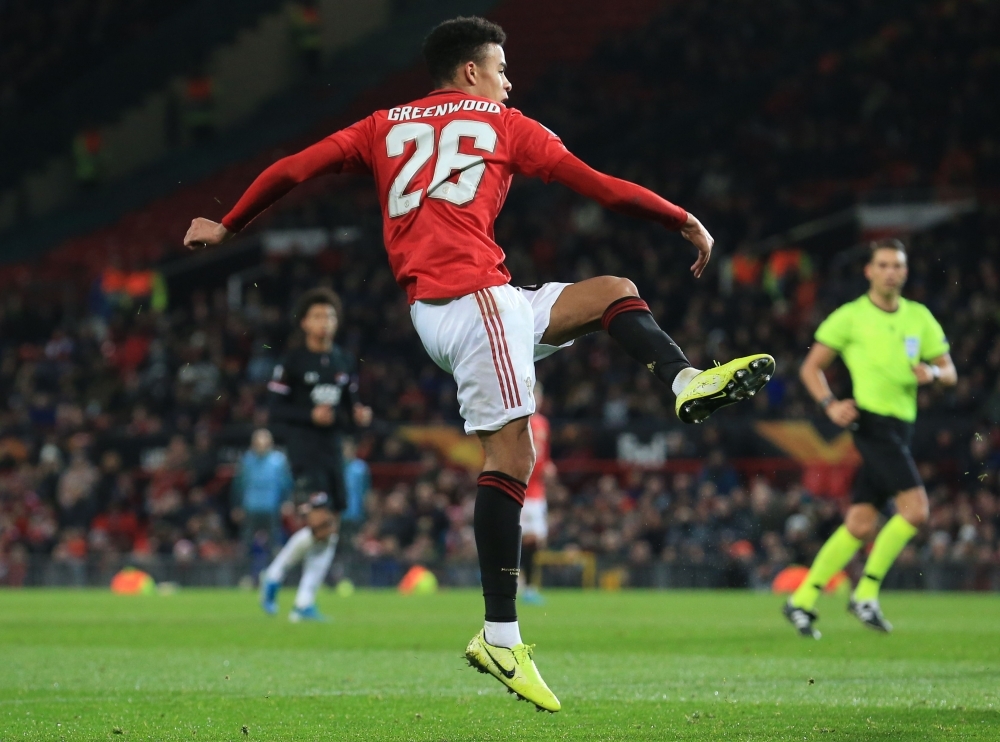 Manchester United's striker Mason Greenwood scores their fourth goal during the UEFA Europa League group L football match between Manchester United and AZ Almaar at Old Trafford in Manchester, north west England, on Thursday. — AFP