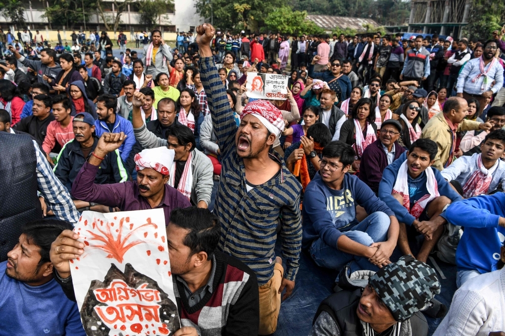 Demonstrators shout slogans during a protest against the government's Citizenship Amendment Bill (CAB) in Guwahati, Assam, on Friday. — AFP