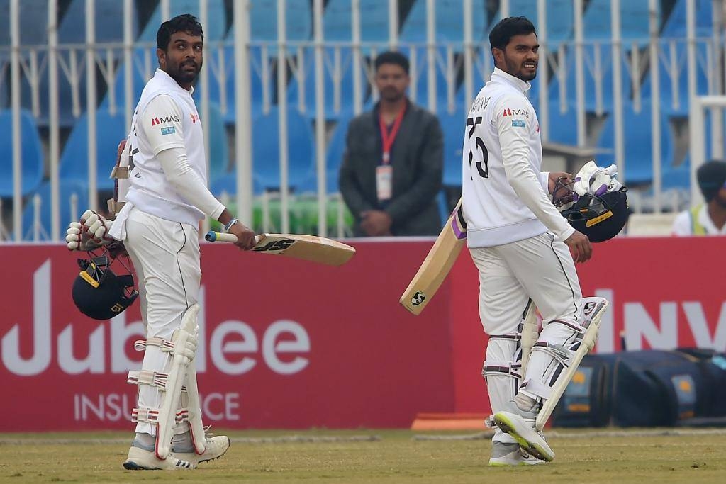 Sri Lanka's Dhananjaya de Silva and Dilruwan Perera walk back to the pavilion after a brief spell at he middle on a rain-hit third day of the Rawalpindi Test against Pakistan.