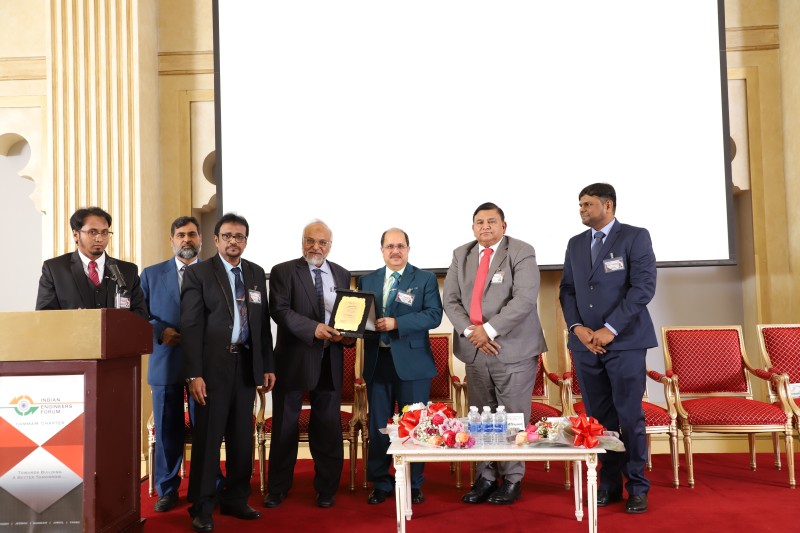 Indian Ambassador Dr. Ausaf Sayeed presents a memento to one of the engineers.