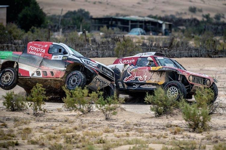 Yazeed Al-Rajhi and Carlos Sainz duel in the desert on Friday.