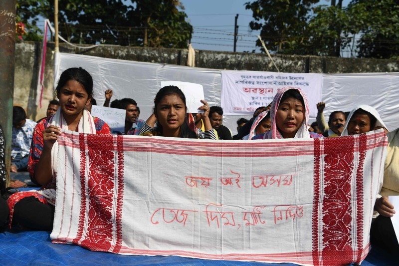 Protestors take part in a demonstration against the Indian government's Citizen Amendement Bill (CAB) in Guwahati on Saturday. -AFP