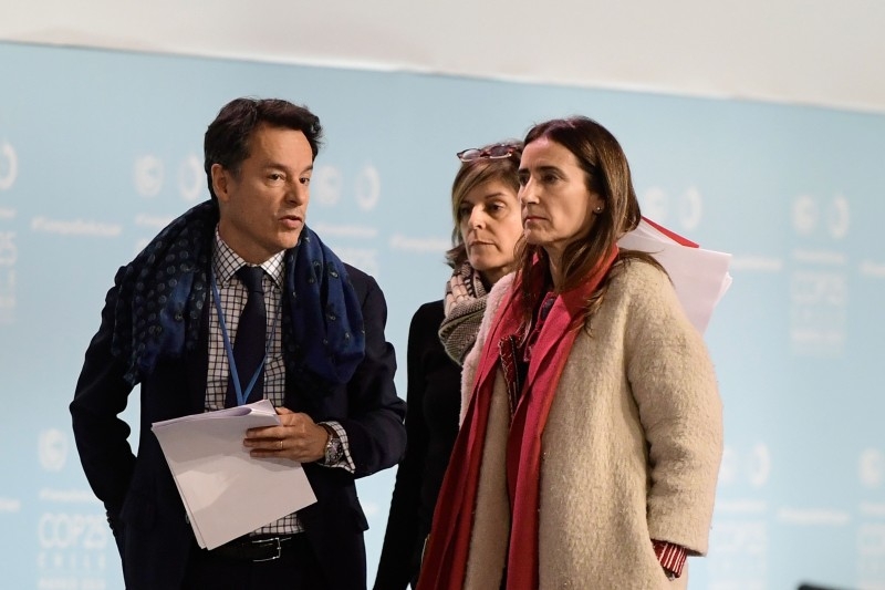 Chile's Minister of Environment and COP25 president Carolina Schmidt leaves after a plenary session during the UN Climate Change Conference COP25 at the 'IFEMA - Feria de Madrid' exhibition centre, in Madrid, on Saturday. -AFP