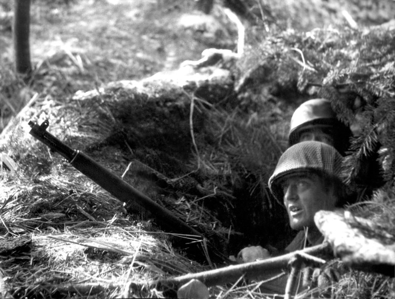 This file photograph taken in December 1944, shows US soldiers somewhere on the western Front during the German troops drive into the US lines during The Battle of The Bulge — The Ardennes Counteroffensive at Sedan in northern France. The Battle of the Bulge was the last German offensive of World War II, and the Siege of Bastogne the scene of a heroic defense by US paratroopers. Seventy-five years later the Belgian town is hosting a weekend of colorful re-enactments followed by solemn ceremonies of remembrance. — AFP