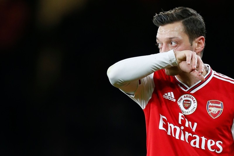 Arsenal's German midfielder Mesut Ozil prepares to take a freekick during the English Premier League football match between Arsenal and Manchester City at the Emirates Stadium in London on Sunday. — AFP