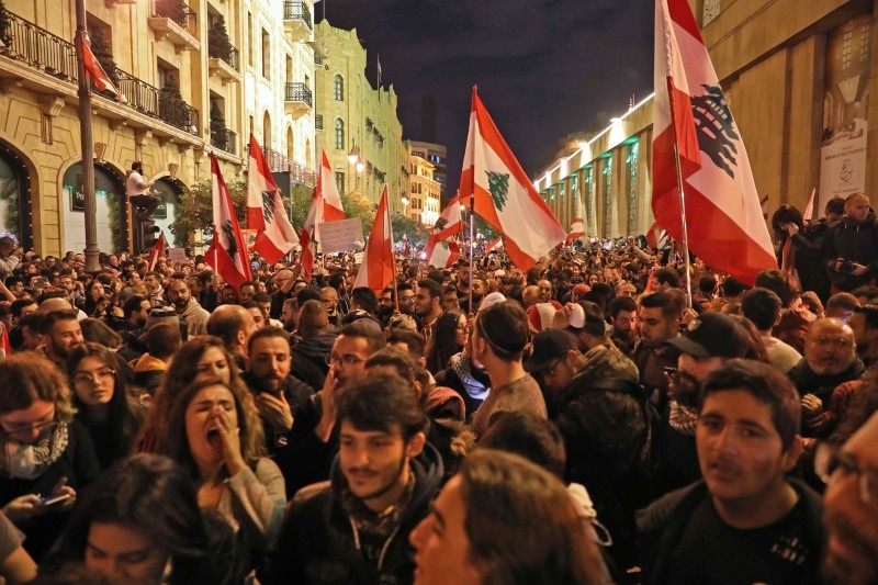 Lebanese demonstrators south slogans in the capital Beirut on Sunday. — AFP