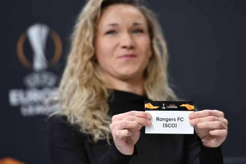UEFA Europa League ambassador Josephine Henning holds the slip of Rangers FC during the UEFA Europa League football cup round of 32 draw ceremony on Monday in Nyon. — AFP