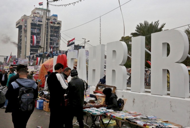 Iraqi protesters gather at Tahrir square in the capital Baghdad on Monday during ongoing anti-government demonstrations. — AFP