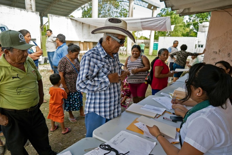 Citizens attend a consultation meeting during a referendum on building a 