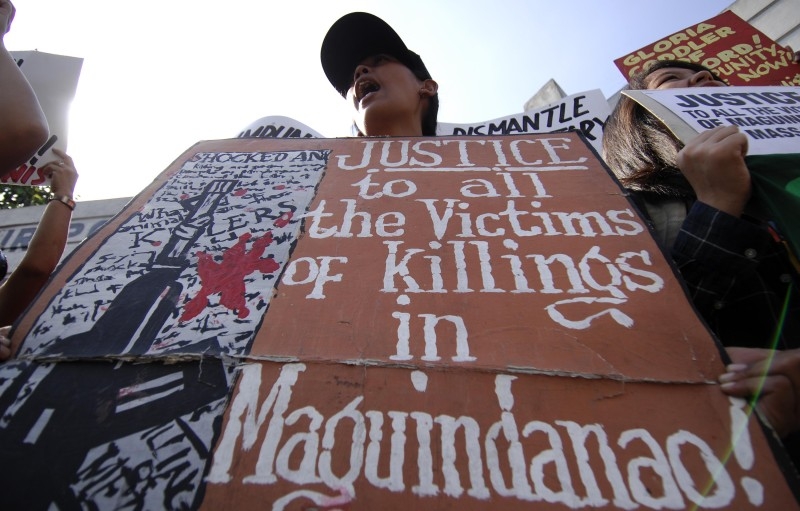  This file photo taken on January 13, 2009 shows human rights advocates holding a protest in front of the Philippine National Police (PNP) headquarters in Camp Crame, Quezon City, where the second hearing of Andal Ampatuan Jr., the principal accussed in the Ampatuan Massacre in Mindanao, is taking place. -AFP