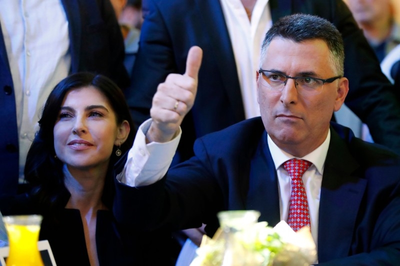 Gideon Sa'ar (R), Israeli Member of Knesset for Likud, is accompanied by his wife Geula Even Sa'ar (L) during the launch of his campaign for Likud party leadership in Or Yehuda, near Tel Aviv, on Monday. -AFP