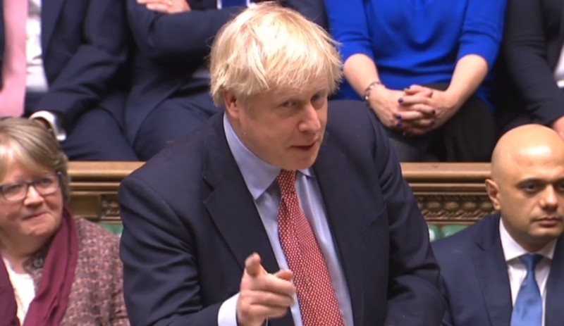 A still image taken from footage broadcast by the UK Parliamentary Recording Unit (PRU) on Tuesday shows Britain's Prime Minister Boris Johnson giving a speech in the House of Commons in London as parliament resumes following a general election. — AFP