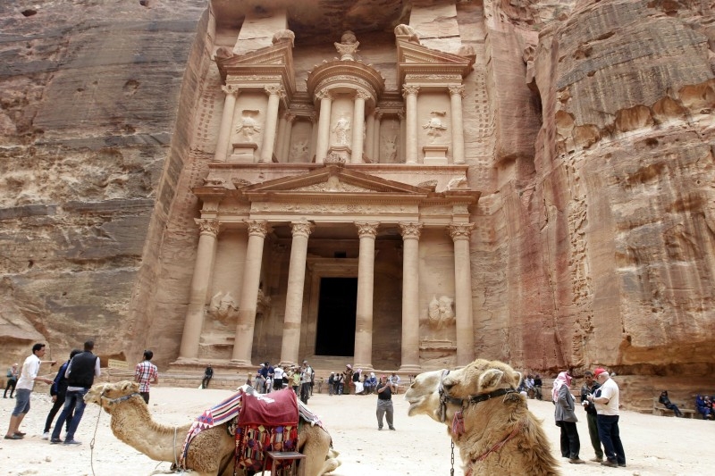 Tourists walk in front of the Khazneh (Treasury) in Jordan's ancient city of Petra in this March 25, 2015 file photo. — AFP