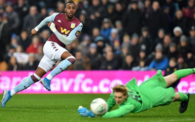 Liverpool's Irish goalkeeper Caoimhin Kelleher, right, saves a shot from Aston Villa's Ivorian striker Jonathan Kodjia during the English League Cup quarter-final football match between Aston Villa and Liverpool at Villa Park in Birmingham, central England, on Tuesday. — AFP
