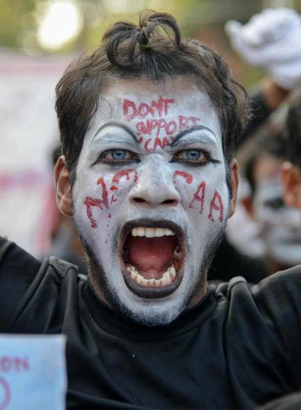 A protester shouts slogans during a protest against India's new citizenship law in Guwahati, Assam, on Wednesday. — AFP