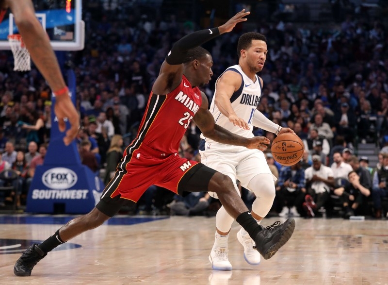 Jalen Brunson #13 of the Dallas Mavericks dribbles the ball against Kendrick Nunn #25 of the Miami Heat at American Airlines Center in Dallas, Texas, in this Dec. 14, 2019 file photo. — AFP