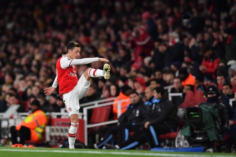 Arsenal's German midfielder Mesut Ozil reacts to his substitution by kicking his gloves along the touchline during the English Premier League football match between Arsenal and Manchester City at the Emirates Stadium in London in this Dec. 15, 2019 file photo. — AFP