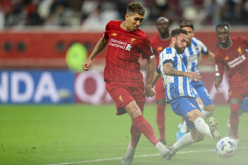 Liverpool's Brazilian midfielder Roberto Firmino shoots to score during the 2019 FIFA Club World Cup semi-final football match between Mexico's Monterrey and England's Liverpool at the Khalifa International Stadium in the Qatari capital Doha on Wednesday. — AFP