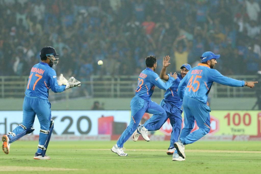 Indian Spinner Kuldeep Yadav and teammates celebrate on his recording a hat trick against West Indies in Visakhapatnam on Wednesday.