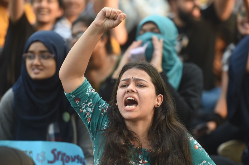 Protesters shout slogans during a demonstration against India's new citizenship law in Guwahati, Assam, on Thursday. — AFP