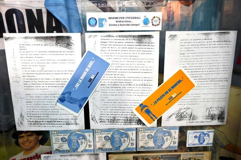 A copy of the 1984 contract for the transfer of Diego Maradona from Barcelona to Naples is on display at the Maradona museum in Naples. — AFP