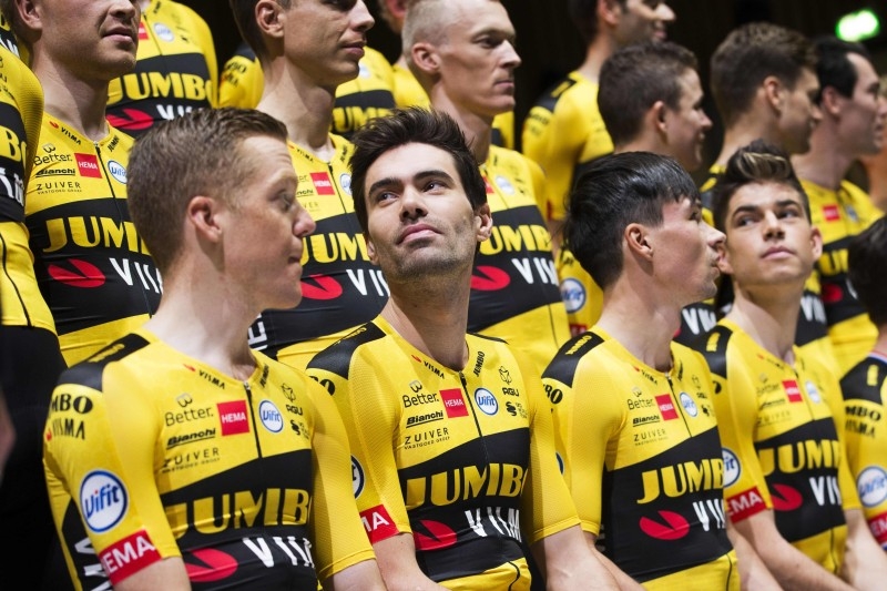 Netherlands' Tom Dumoulin (C) and Steven Kruiswijk (L) and Slovenia's Primoz Roglic (R) attend the presentation of Team Jumbo-Visma cycling team at the HEMA headquarters in Amsterdam on Friday. — AFP