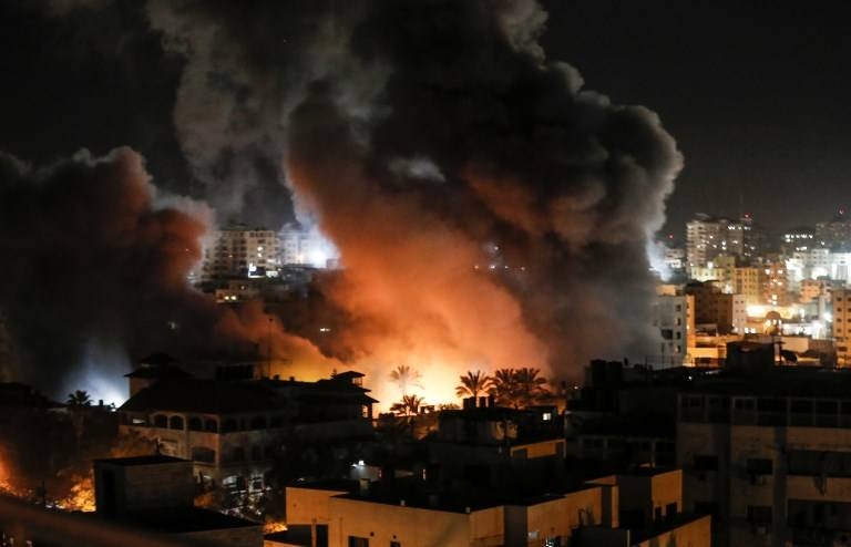 Fire and smoke billow above buildings in Gaza City during reported Israeli strikes in this March 25, 2019 file photo. — AFP