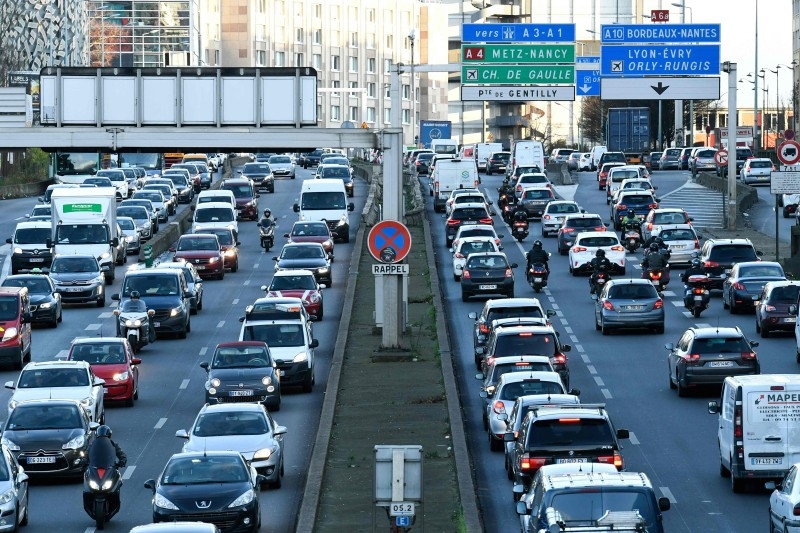 People drive their cars and motorbikes on the ring road of Paris also called the peripherique, on Friday, on the 16th day of a nationwide multi-sector strike against the government's pensions overhaul. — AFP