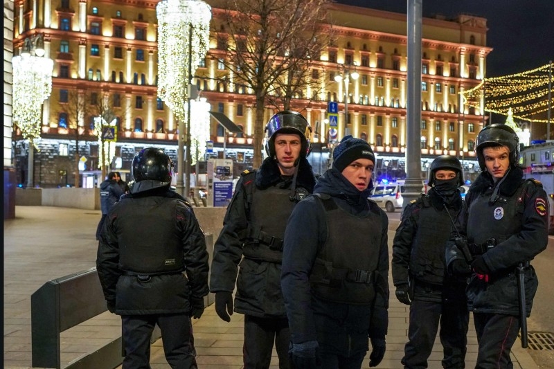 Russian police officers patrol a street next to the FSB security service's office in Moscow on Thursday. — AFP