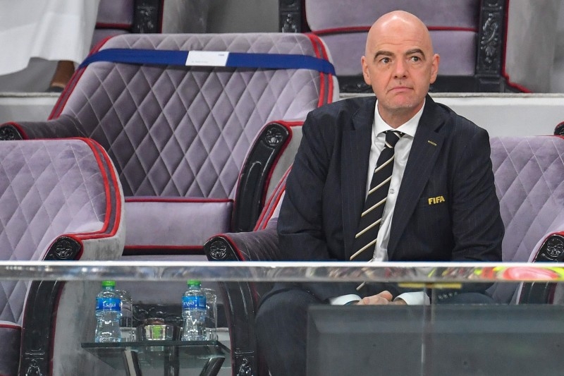 FIFA President Gianni Infantino (R) and Liverpool CFO Peter Moore (L) attend the 2019 FIFA Club World Cup semifinal football match between Mexico's Monterrey and England's Liverpool at the Khalifa International Stadium in the Qatari capital Doha on Wednesday. — AFP