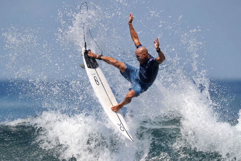 In this file photo taken on May 19, 2019 Kelly Slater of the US performs a maneuver on a wave during the World Surf League men's championship tour surfing event at Keramas in Gianyar on Indonesia's resort island of Bali. Surfing legend Kelly Slater, seen by many as the greatest of all time, won't be competing at the Tokyo Olympics. — AFP