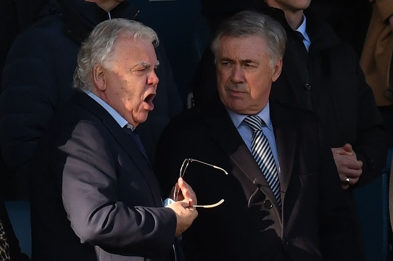 Everton's Italian head coach Carlo Ancelotti (L) chats to Everton's English chairman Bill Kenwright at the English Premier League football match between Everton and Arsenal at Goodison Park in Liverpool, north west England on Saturday. — AFP