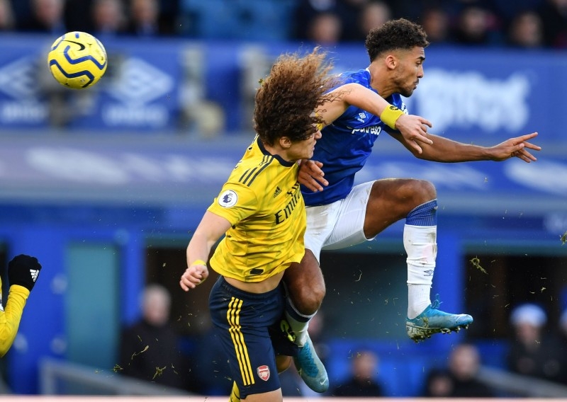 Arsenal's Brazilian defender David Luiz (L) vies with Everton's English striker Dominic Calvert-Lewin during the English Premier League football match at Goodison Park in Liverpool, north west England on Saturday. — AFP