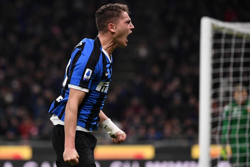 Inter Milan's Italian forward Sebastiano Esposito celebrates after scoring a penalty during the Italian Serie A football match Inter Milan vs Genoa on Saturday at the San Siro stadium in Milan. — AFP