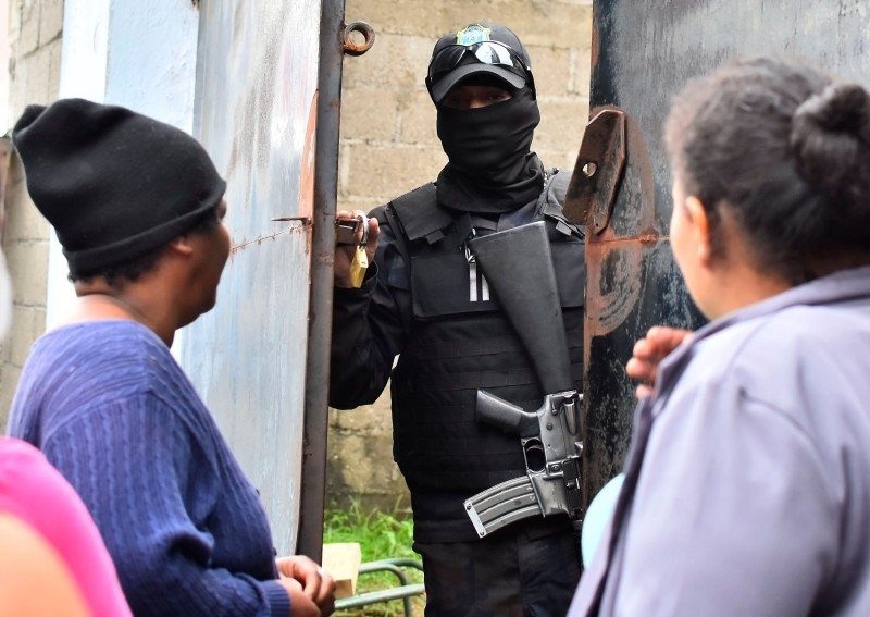 Relatives of inmates react after getting information about their loved ones in front of the penitentiary of Tela, Atlantida department, Honduras, on Saturday, following clashes occurred at the jail. -AFP