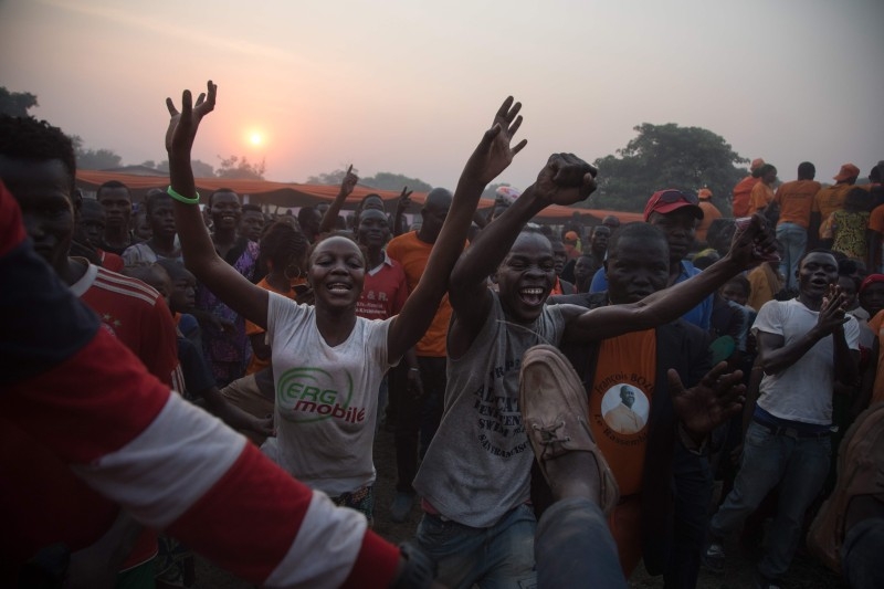 Former Centrafrica's President François Bozize (L) and National Convergence Kwa Na Kwa (KNK) party general secretary Bertin Bea (C) greet the crowd in the Boeing district of Bangui, on Saturday. AFP 