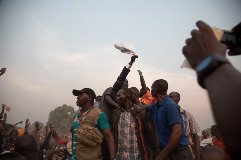 Former Centrafrica's President François Bozize (L) and National Convergence Kwa Na Kwa (KNK) party general secretary Bertin Bea (C) greet the crowd in the Boeing district of Bangui, on Saturday. AFP 