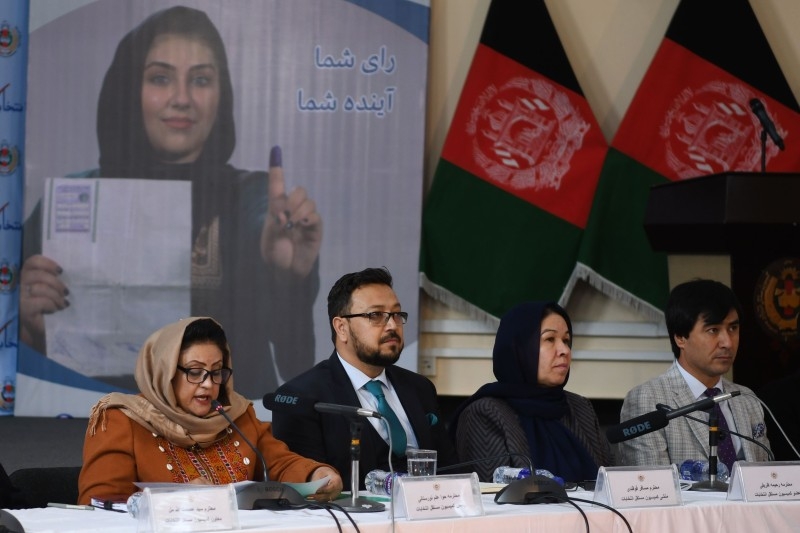 Head of the Afghan Independent Election Commission (IEC) Hawa Alam Nuristani (L) announces the preliminary elections results during a press conference in Kabul on Sunday. -AFP