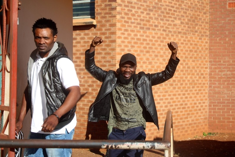  In this file photo taken on May 21, 2018, Zambian musician Chama Fumba, known as Pilato (R), gestures as he arrives at the Lusaka Magistrate Court. -AFP