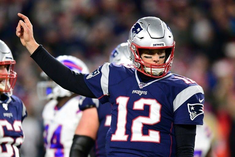 New England quarterback Tom Brady threw for 271 yards and a touchdown to spark the Patriots over Buffalo 24-17 in an NFL game. — AFP