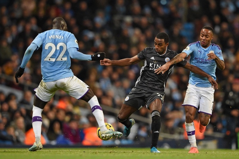 Leicester City's Portuguese defender Ricardo Pereira (C) vies with Manchester City's French defender Benjamin Mendy (L) and Manchester City's midfielder Raheem Sterling (R) during the English Premier League football match at the Etihad Stadium in Manchester, north west England, on Saturday. — AFP