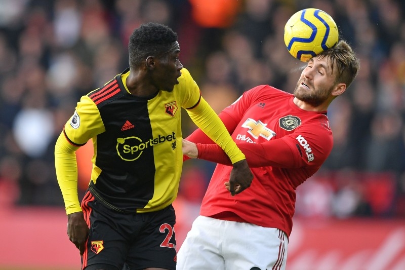 Manchester United's English defender Luke Shaw (R) vies with Watford's Senegalese midfielder Ismaila Sarr (L) during the English Premier League football match between Watford and Manchester United at Vicarage Road Stadium in Watford, north of London on Sunday. — AFP