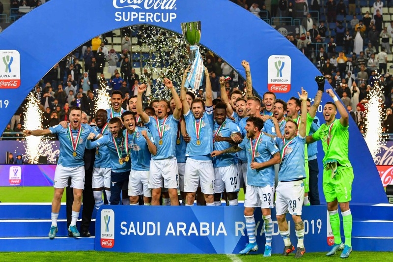 Lazio's players celebrate after winning the Supercoppa Italiana final football match between Juventus and Lazio at the King Saud University Stadium in the Saudi capital Riyadh on Dece.22, 2019. — AFP 